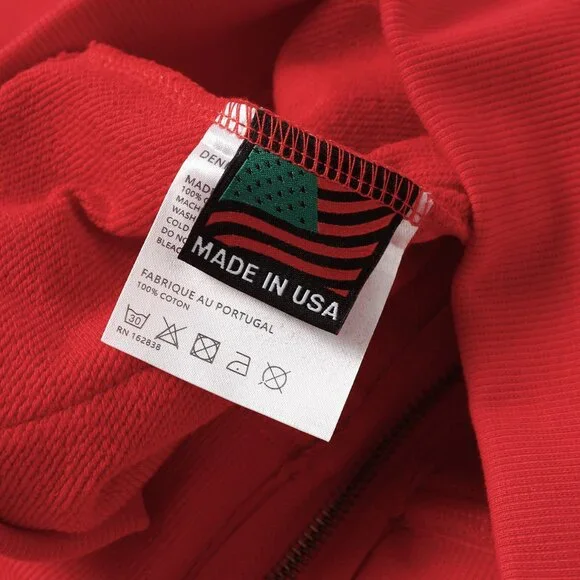 Red lettering Denim Tears zip-up hooded jacket
